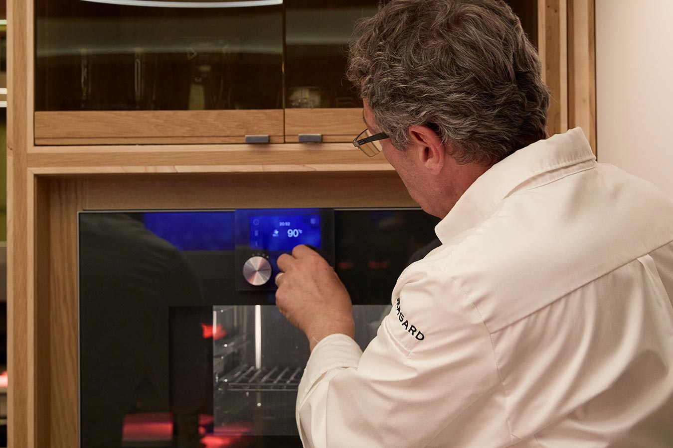 Daniel Galmiche preparing dinner with an oven